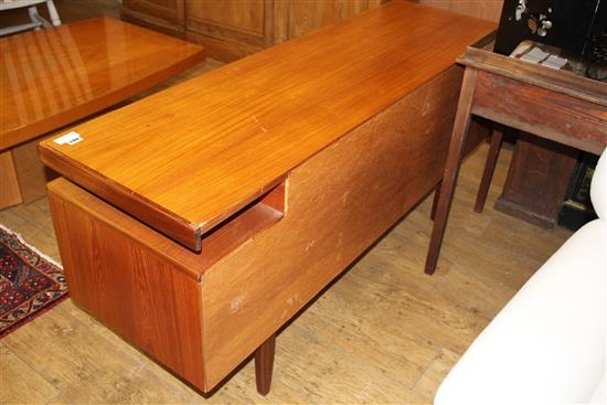 A 1950s G-Plan teak dressing table, fitted five drawers, W.152cm D.46cm H.70cm